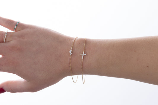 Diamond cross bracelet in 18K gold