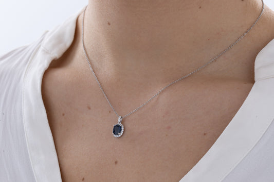 Oval sapphire and halo diamond necklace