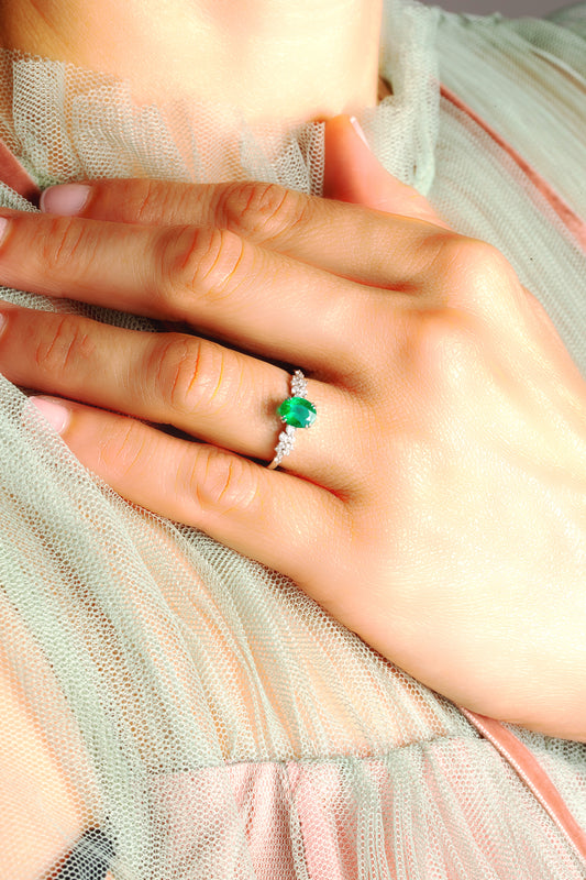 Oval Emerald and cluster diamond ring in 18K white gold